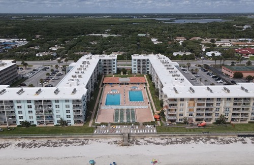 New Smyrna Beach Condo | Chic Ocean/Pool View 2/2 Condo in New Smyrna Beach!