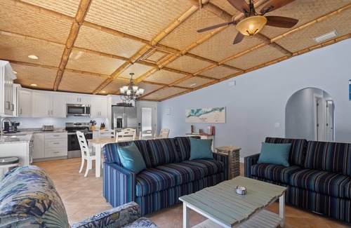 Holmes Beach House | Chiki Tiki West: Eclectic Beach House, Tiki Bar & Pool, 2.5 Blocks to Beach by Anna Maria Life