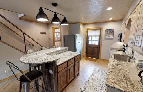 Red River House | CJ Townhouse 3 - On the River - In Town - Across from the Fishing Ponds - Wood B