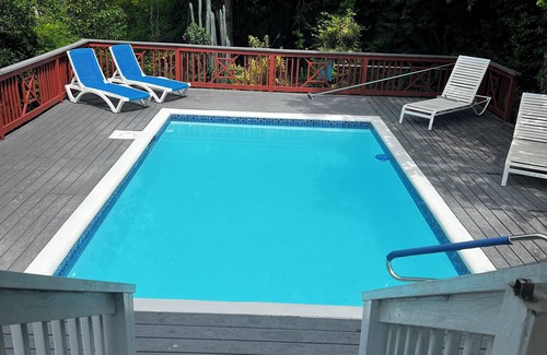 Monte Villa | Classic Comfortable Caribe style villa with an expansive porch and pool.