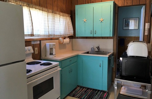 Edgewater Shores Cottage | Classic Honeymoon Beach Cottage. Private, Romantic, Oceanfront. Pet friendly.