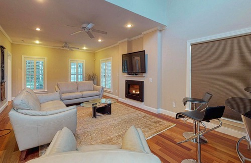 Lagoon Heights House | Classic, private estate with a large lot, a stone patio & a fireplace!
