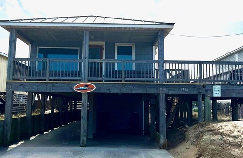 Kitty Hawk House | Classic, semi ocean front OBX cottage steps away from the beach.