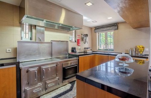 Paredes House | Classic Villa w/Gym and Pool Access by HostWise