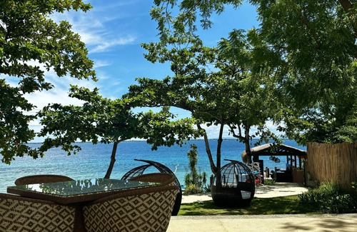 Lapu-Lapu Condo | Clean and cozy ocean view 1BR condo, Mactan, WiFi, pool, private beach