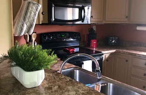 Chalet Village Condo | Close to town but in the mountains