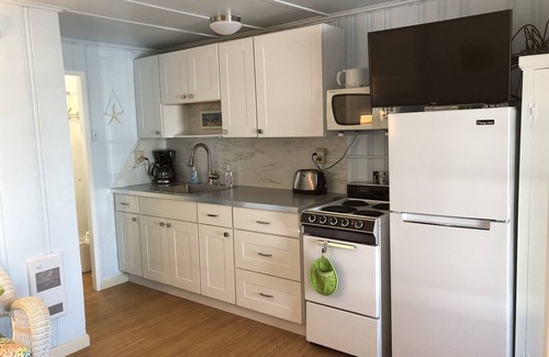Wells Beach Condo | COASTAL CONDOMINIUM #16. COZY CONDO STEPS FROM THE BEACH!