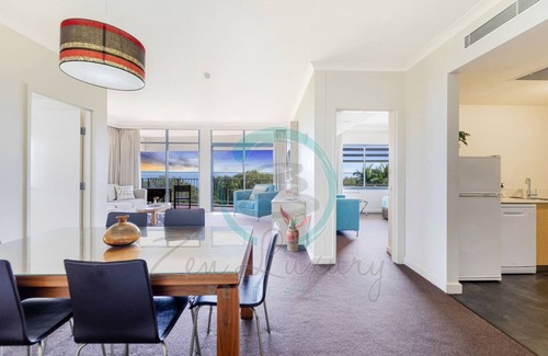 Darwin City Centre Apartment | Coastal Elegance Sunset Pool Balcony Dining
