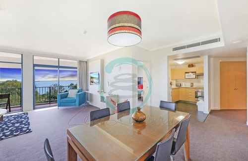 Darwin City Centre Apartment | Coastal Elegance Sunset Pool Balcony Dining