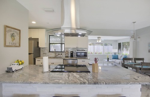 Juno Beach House | Coastal house in Juno beach with heated saltwater pool. Walk to the local beach.