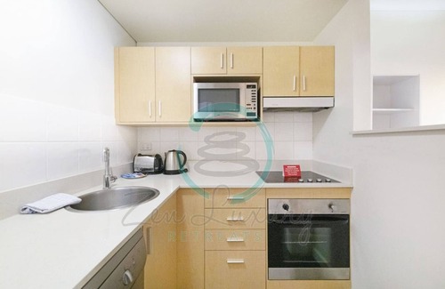 Darwin City Centre Apartment | Coastal Splendor Seaview Pool Balcony Dining