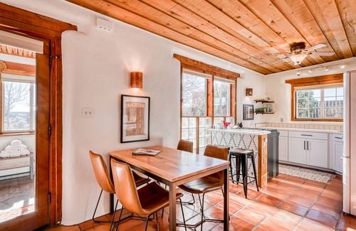 Taos House | Colorful dog-friendly home with sweeping views, a private hot tub, & large yard