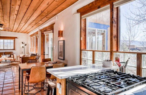 Taos House | Colorful dog-friendly home with sweeping views, a private hot tub, & large yard