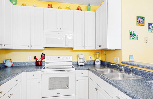 Orange Beach Condo | Colorful Ground-Floor Condo w/Shared Pool, Central A/C, Private W/D, Free WiFi