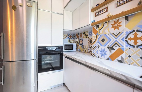 Tirana Apartment | Colorful Oasis with Sunny Balcony