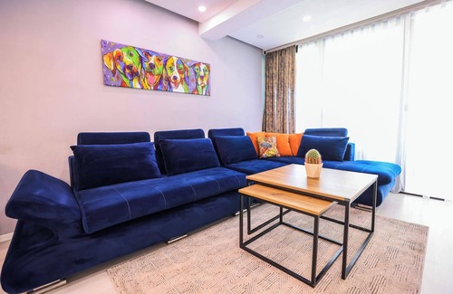 Tirana Apartment | Colorful Oasis with Sunny Balcony