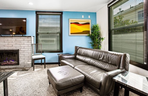 Brighton House | Colorfully renovated home with WiFi, fireplace, deck, patio, grill, & firepit