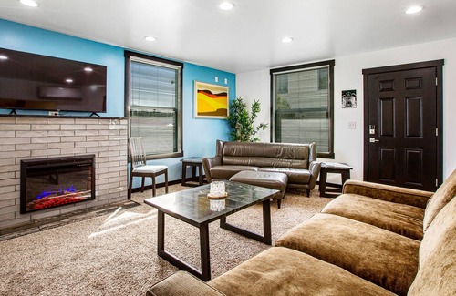 Brighton House | Colorfully renovated home with WiFi, fireplace, deck, patio, grill, & firepit