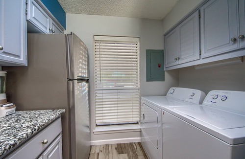 New Braunfels Condo | COMAL RIVERFRONT! Across from Schlitterbahn! Walk to Downtown New Braunfels!