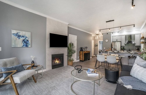 Cedar Condo | Come cozy up next to the fireplace at our contemporary condo centrally located