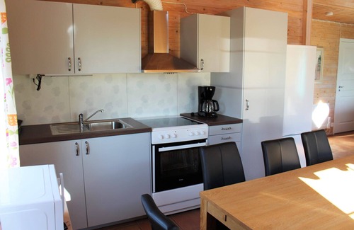 Vackelsang Ski Chalet | Comfort holiday home with lake location, motor boat and pool