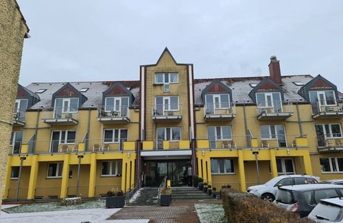 Lowenbruch Apartment | Comfort room with a view of the sunset and town