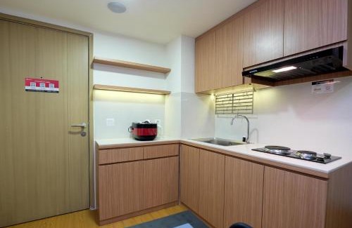 Cikarang Apartment | Comfortable 2BR with Workspace at Meikarta Apartment By Travelio