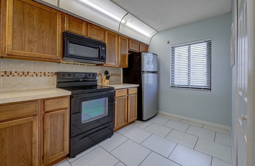 Cocoa Beach Condo | Comfortable, Coastal, Beachy Condo with Balcony, Pool, Tennis Court & Family Fun!