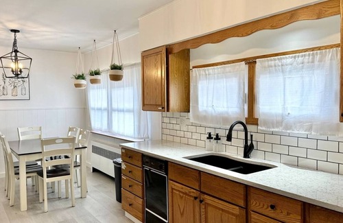 West End House | Comfortable furnishings, central air conditioning, covered patio and outdoor lounge furniture