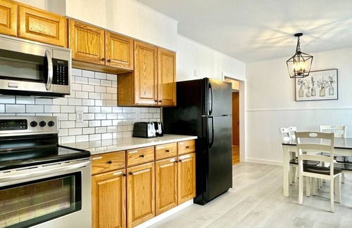 West End House | Comfortable furnishings, central air conditioning, covered patio and outdoor lounge furniture