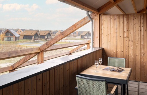 Nieuwvliet Apartment | Comfortable hotel room with view out over the water