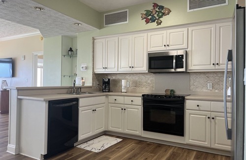 Thomas Drive Condo | Completely renovated, huge balcony ocean front condo/beach chairs + umbrella!