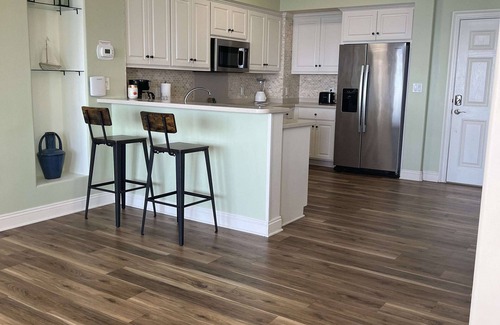 Thomas Drive Condo | Completely renovated, huge balcony ocean front condo/beach chairs + umbrella!