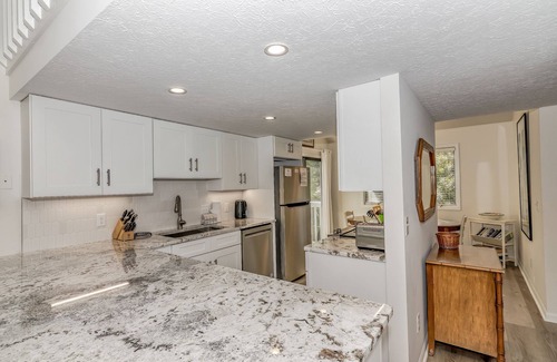 Bald Head Island Condo | Condo with community pool and balcony with forest view, recently renovated