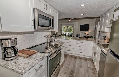 Bald Head Island Condo | Condo with community pool and balcony with forest view, recently renovated