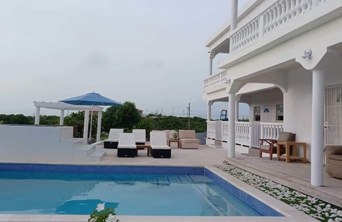 Wheeland Settlement House | Condo with ocean view, private balcony & private Jacuzzi (unit 3)