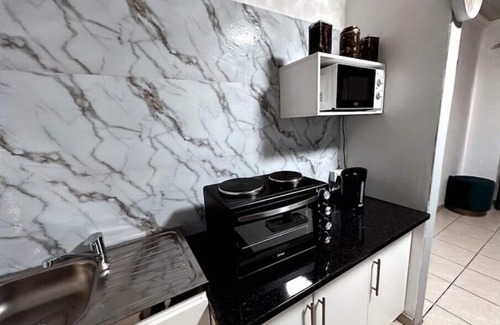 Newcastle House | Contemporary Gem: Studio with Serene Pool Viewn