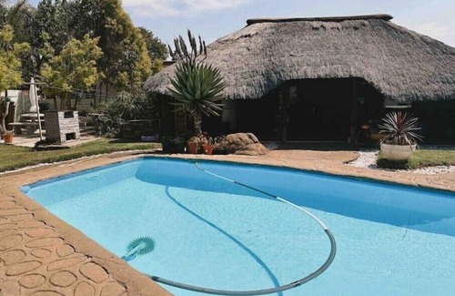Newcastle House | Contemporary Gem: Studio with Serene Pool Viewn