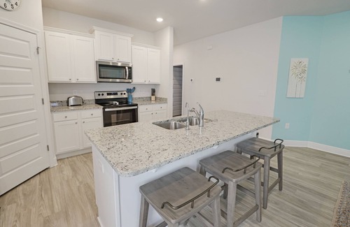 Port St. Joe House | "CORAL SUNSETS" IS A 4BD W/MOTHER-IN-LAW SUITE! OPTION TO RENT GOLF CART, PET FRIENDLY!