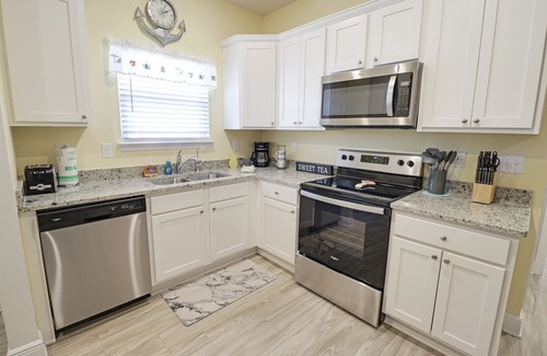 Port St. Joe House | "CORAL SUNSETS" IS A 4BD W/MOTHER-IN-LAW SUITE! OPTION TO RENT GOLF CART, PET FRIENDLY!