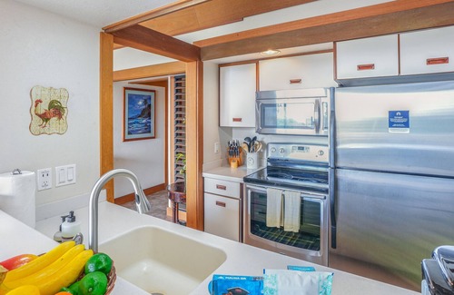Poipu House | Corner condo with garden view, lanai, pool & hot tub - walk to Kiahuna Beach