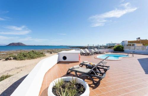 Corralejo Villa | Corralejo Beachfront Villa Remos with Lobos Island View, Private Pool, Wifi & BBQ by Amazzzing Travel