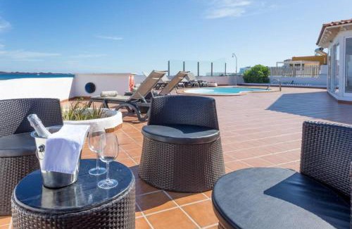Corralejo Villa | Corralejo Beachfront Villa Remos with Lobos Island View, Private Pool, Wifi & BBQ by Amazzzing Travel