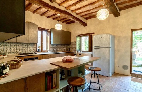 Buonconvento House | Cortile del Pozzo family home sleeps 8 with private garden by Italian Apartments