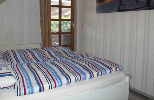 Juliusruh Apartment | Cosy apartment for 4 guests with WIFI, TV, balcony, pets allowed and parking