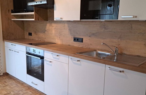 Oberwang Villa | Cosy apartment in villa for 4 guests with WIFI, TV and balcony