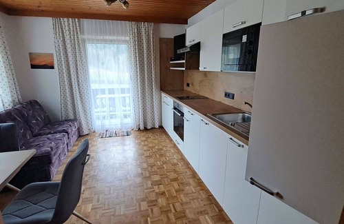 Oberwang Villa | Cosy apartment in villa for 4 guests with WIFI, TV and balcony