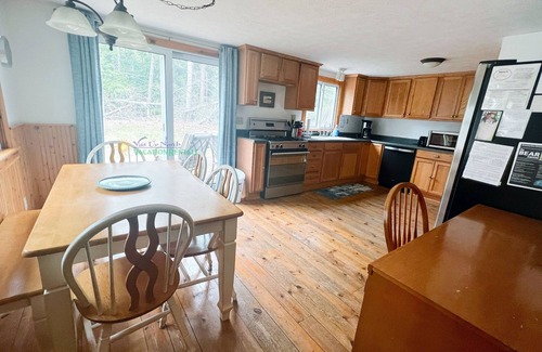 Glen Arbor House | Cottage in Glen Arbor with Crystal River frontage, Canoe, FP, A/C, Dogs ok
