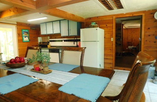 Manattee Road House | Country living at it's best! Rustic 1908 Barn nestled on 2.5 acres of old oaks