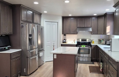 Kent House | Courtyard and City view with totally remodeled house